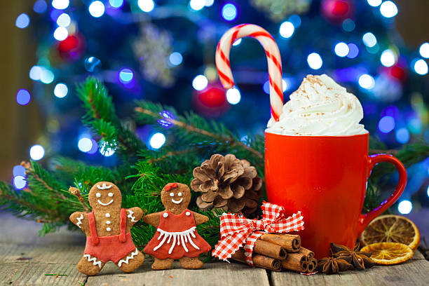istock Christmas cappuccino and gingerbread cookies infront Christmas tree 624718876