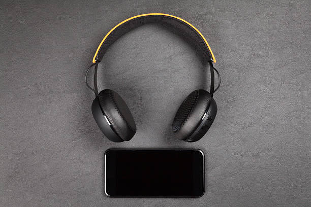 istock Black modern smartphone and headphones 624719628