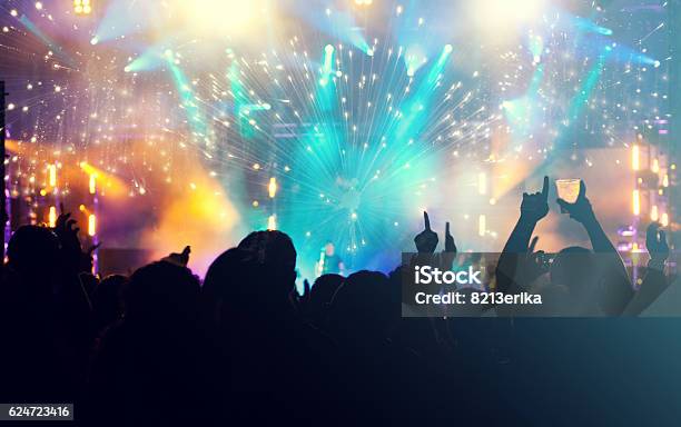 Cheering Crowd And Fireworks New Year Concept Stock Photo - Download Image Now - Crowd of People, Arts Culture and Entertainment, Carefree
