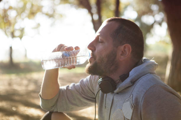 istock Young man sporting, listening to music 624724094