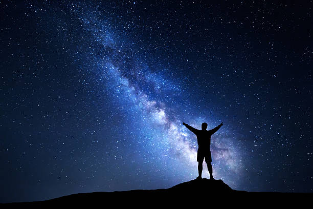 istock Milky Way with silhouette of a standing alone man 624739948