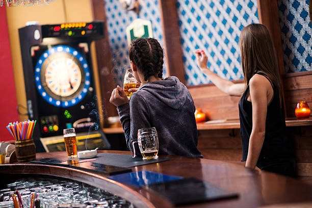 istock Friends playing darts in a club 624739964