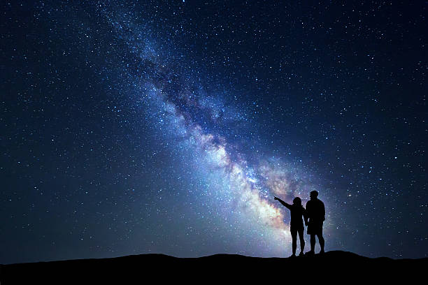 istock Milky Way with people on the mountain. Landscape 624740066