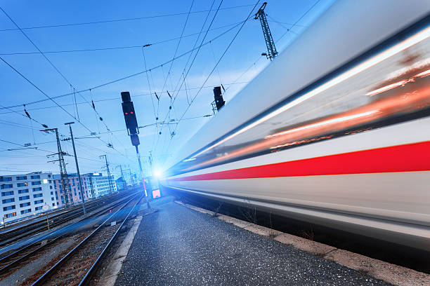 istock Modern high speed passenger train on railroad in motion 624740488