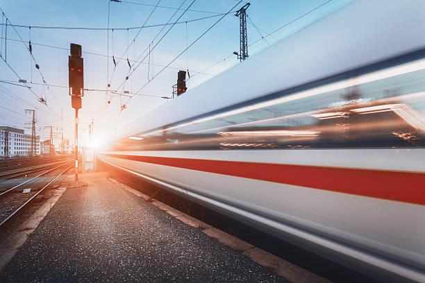 modern high speed passenger train on railroad in motion - transportation railroad track train railroad car imagens e fotografias de stock