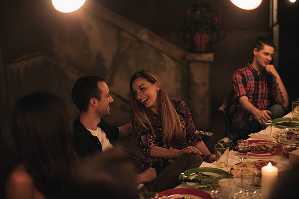 Smiling friends at the dinner party