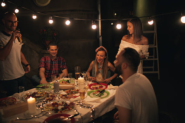 istock Smiling friends at the dinner party 624740976