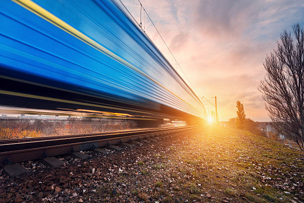 istock High speed blue passenger train on railroad track in motion 624741574