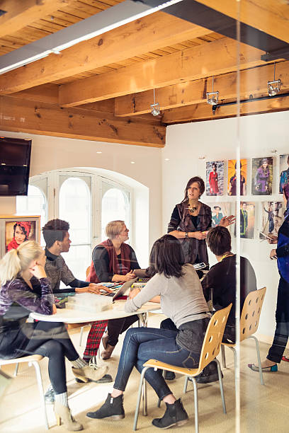 istock Meeting in small creative start-up enterprise lead by woman. 624743124