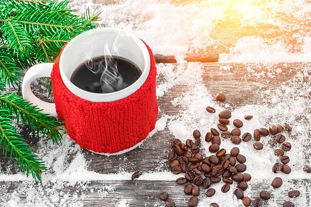istock Cup of hot coffee on the old snowy table 624744884