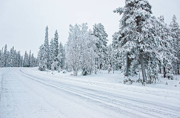 istock Snow covered road in Ruka in Finland, Arctic 624745404