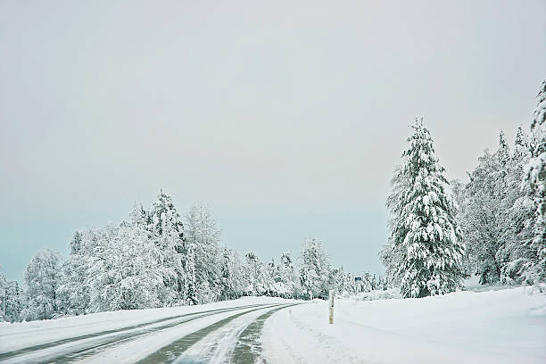 istock Snow covered road in Finland on the Arctic pole circle 624745428