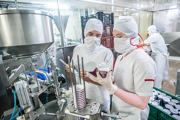 istock People working at a food factory 624745752
