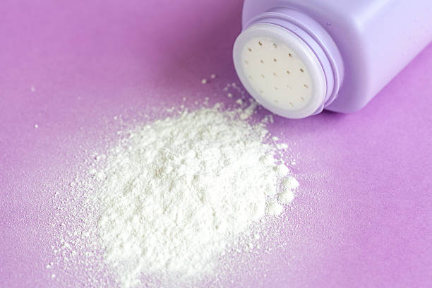 istock baby powder on purple background 624745880