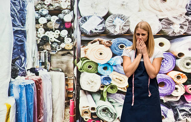 istock Seamstress looking upset in textile industry 624746180
