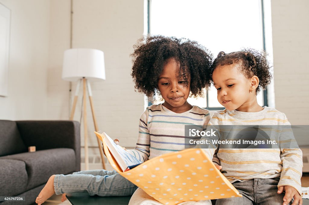Multilingual learners Reading toddlers African Ethnicity Stock Photo