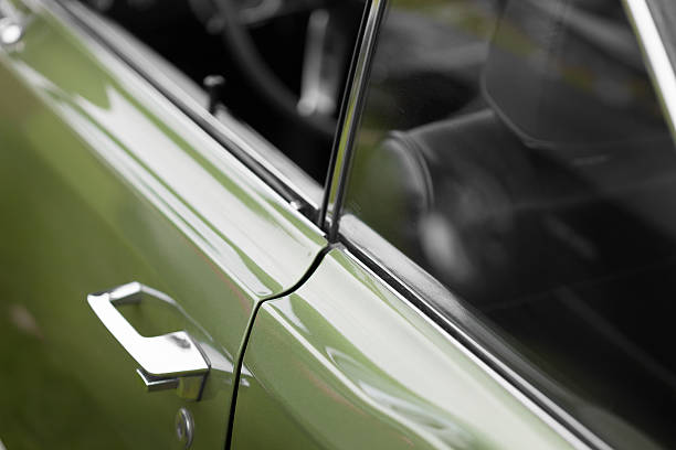 istock Car handle of a green shiny classic vintage car 624748480