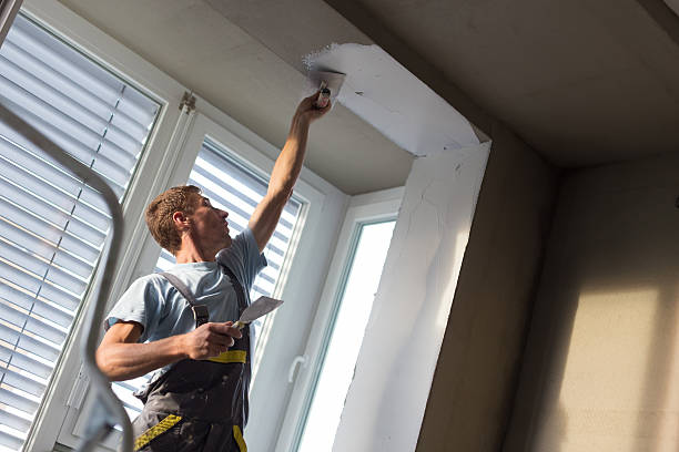 istock Plasterer renovating indoor walls and ceilings. Finishing works. 624748762
