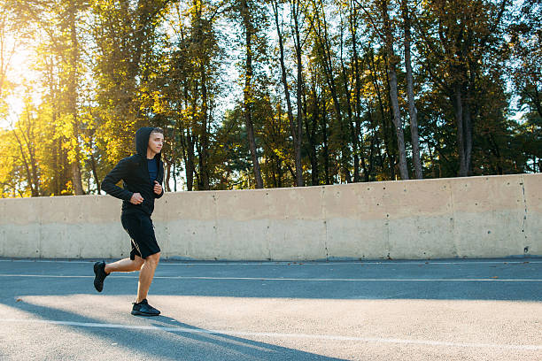 istock Glad sportsman running on stadium 624750698