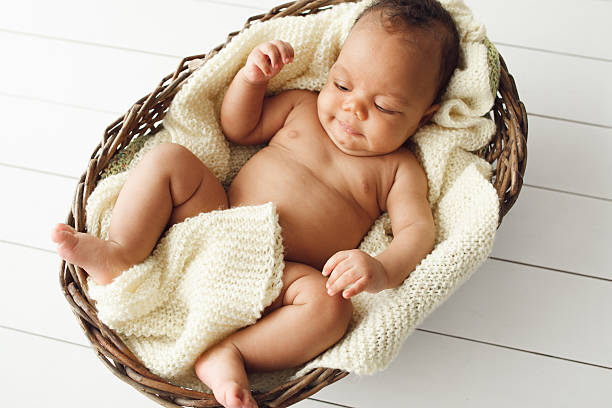 istock Newborn african baby in wicker basket, flat lay 624750802