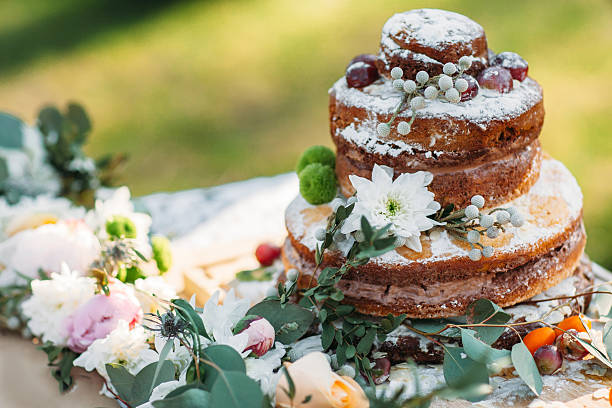 Chocolate cake on table with flowers, free space