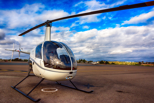 Carlsbad, United States - January 15, 2016:  A Robinson R22 helicopter parked at the airport.