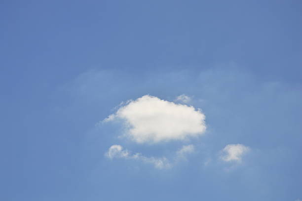 istock fluffy cloud floating on clear sky in sunny day 624768778