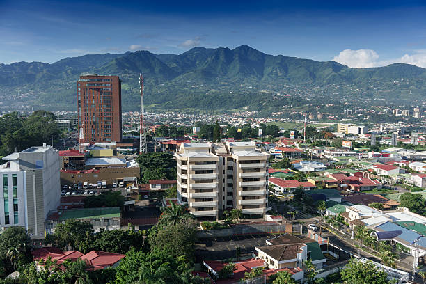 istock Elevated view of cityscape with mountain range in background, Co 624770826