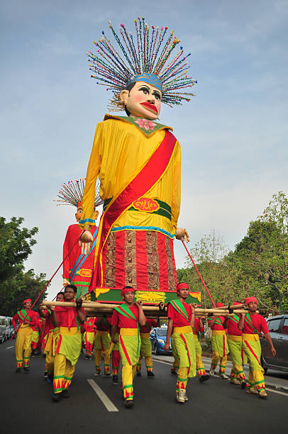 People carry giant ondel-ondel in Jakarta Carnival events Jakarta, Indonesia - October 28, 2012: People carry giant ondel-ondel in Jakarta Carnival events ondel ondel betawi stock pictures, royalty-free photos & images