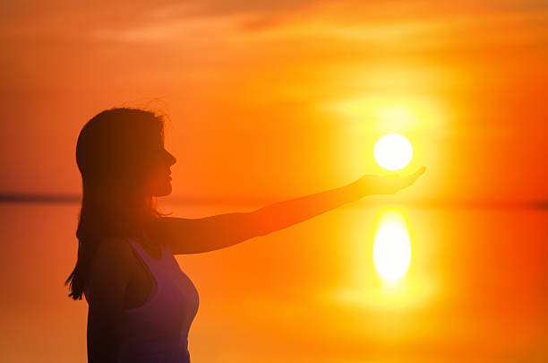 istock Beautiful female model enjoying sunset 624849184