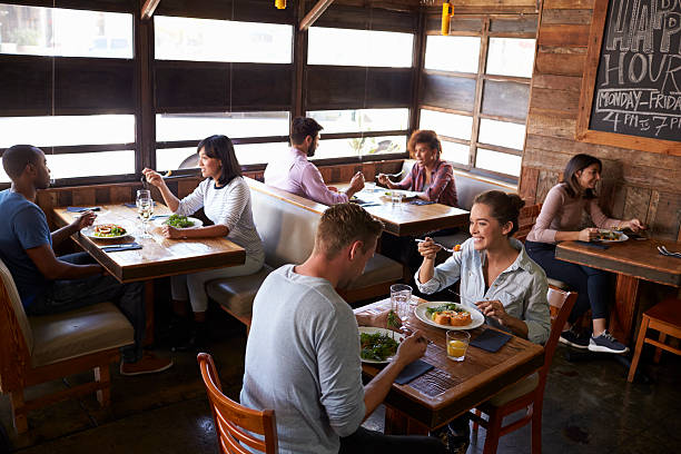 istock Couples relaxing over lunch in a restaurant, elevated view 624851528