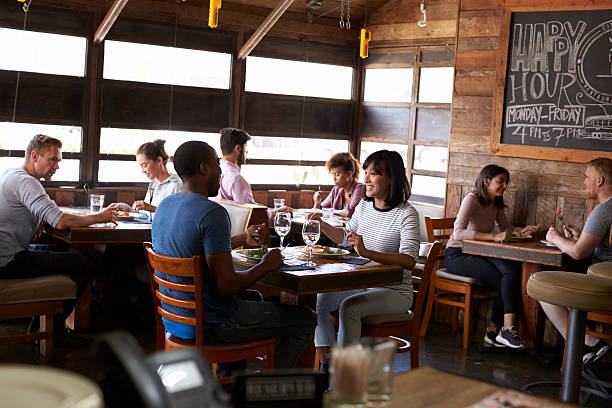 istock Couples enjoying lunch in a busy restaurant 624851532
