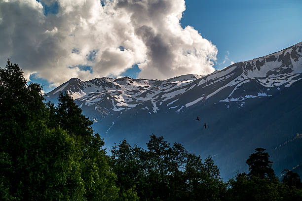 istock grandiose clouds over the majestic snow-capped peaks 624851854