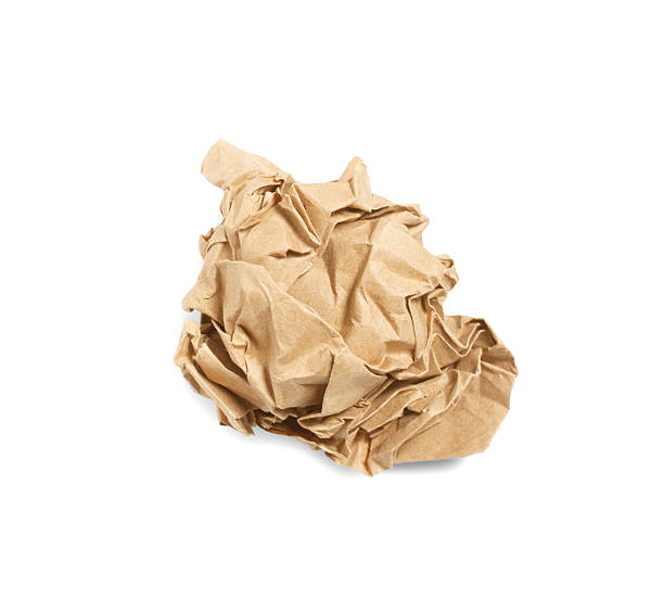 istock Crumpled brown paper ball isolated over white background 624852610