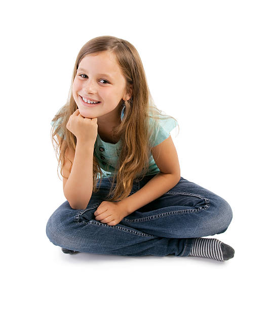 istock girl sitting on floor 624854420
