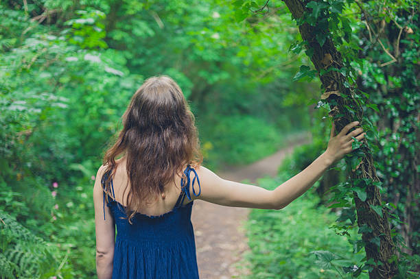 istock Woman standing in forest 624854462