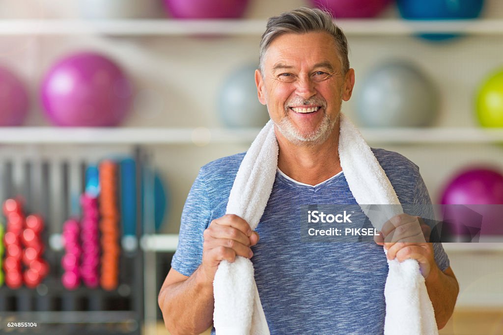 Senior man in health club Exercising Stock Photo