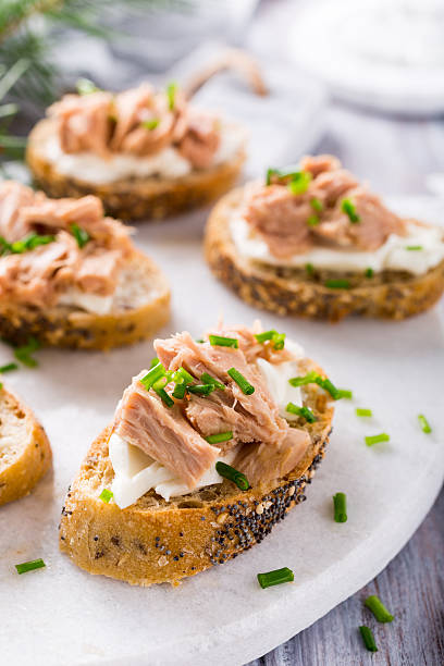 istock Slices of baguette with fresh tuna 624855716