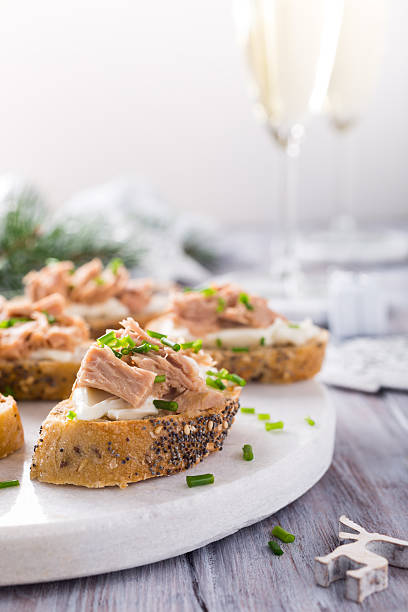 istock Slices of baguette with fresh tuna 624855828