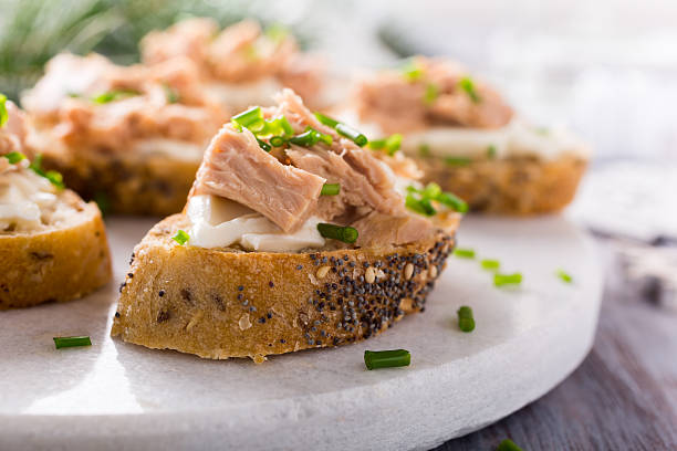 istock Slices of baguette with fresh tuna 624855896