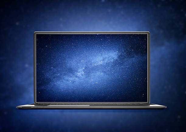 istock Laptop on the background of galaxy. 624856072