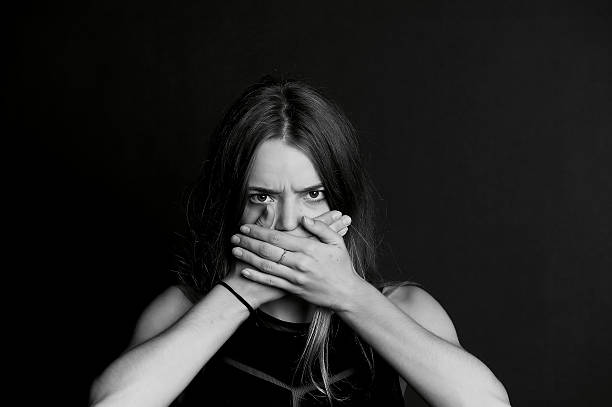 istock Speak no evil. The girl closes your mouth 624856570