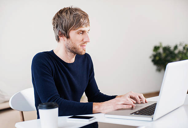 istock Place of work. Man is working with laptop 624856976
