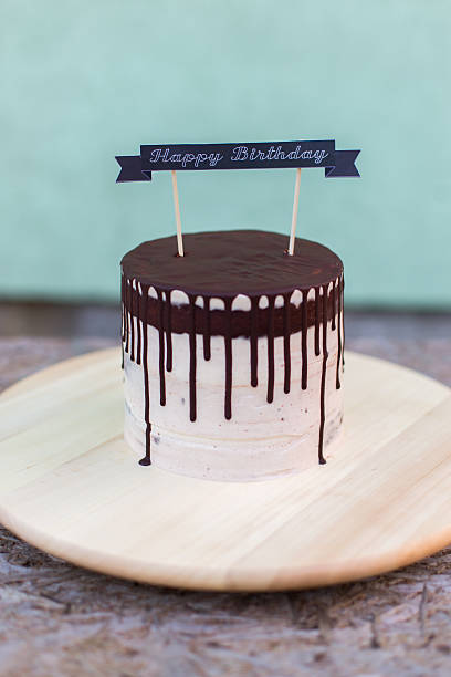 istock chocolate cake with birthday naked on a background 624856994