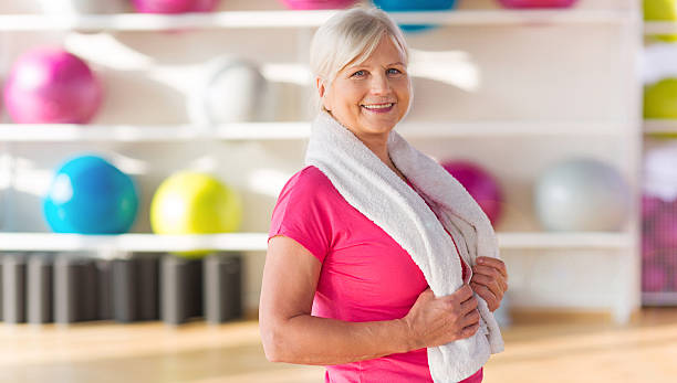 istock Senior woman at the gym 624857064