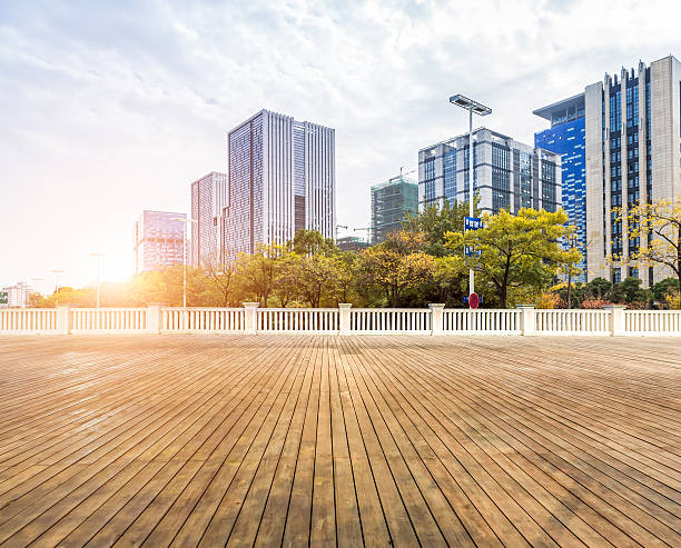 istock Empty wood floor with modern business office building 624866790