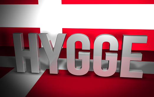 The word HYGGE against the flag of Denmark. A trending Nordic fashion of winter 2016.