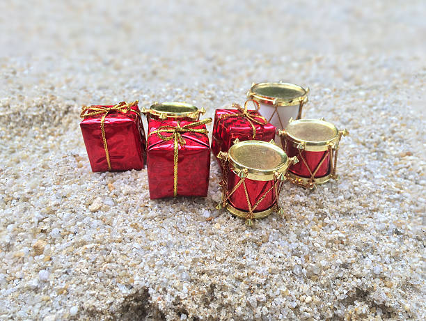 istock Popular gift box.Group of presents on sand 624871958