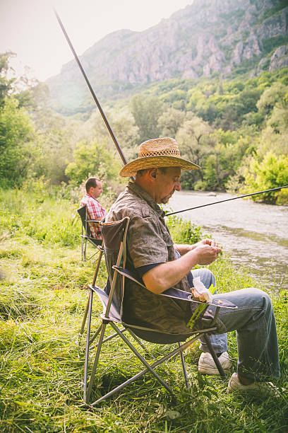istock people fishing on the river 624871980