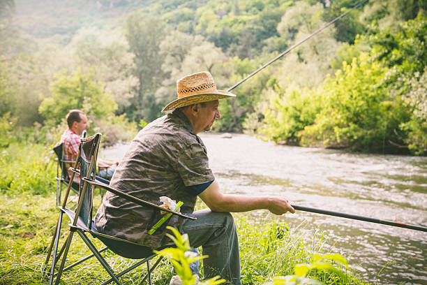 istock people fishing on the river 624872446
